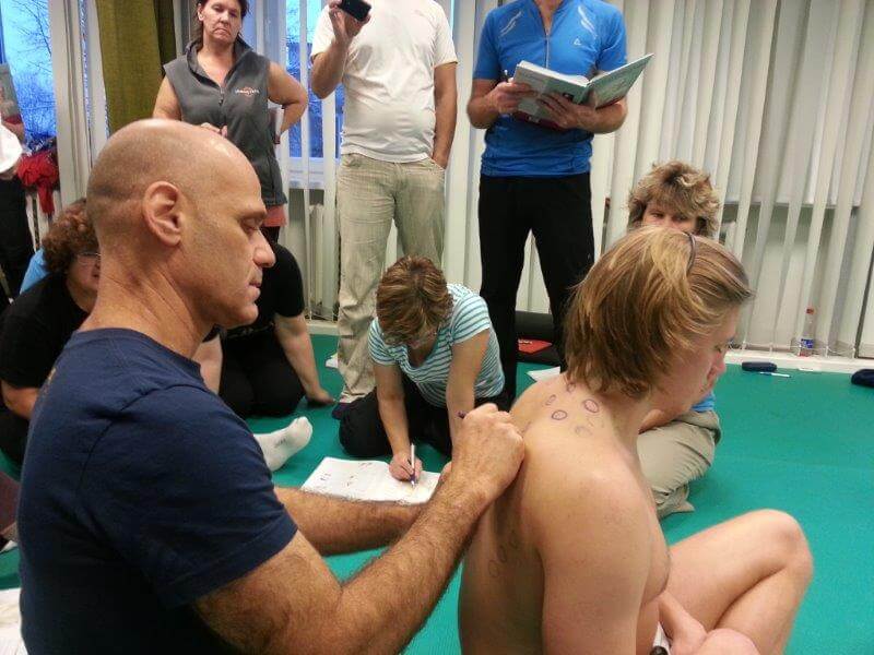 Noam Tyroler demonstrating Thai Acupressure treatment for upper back pain