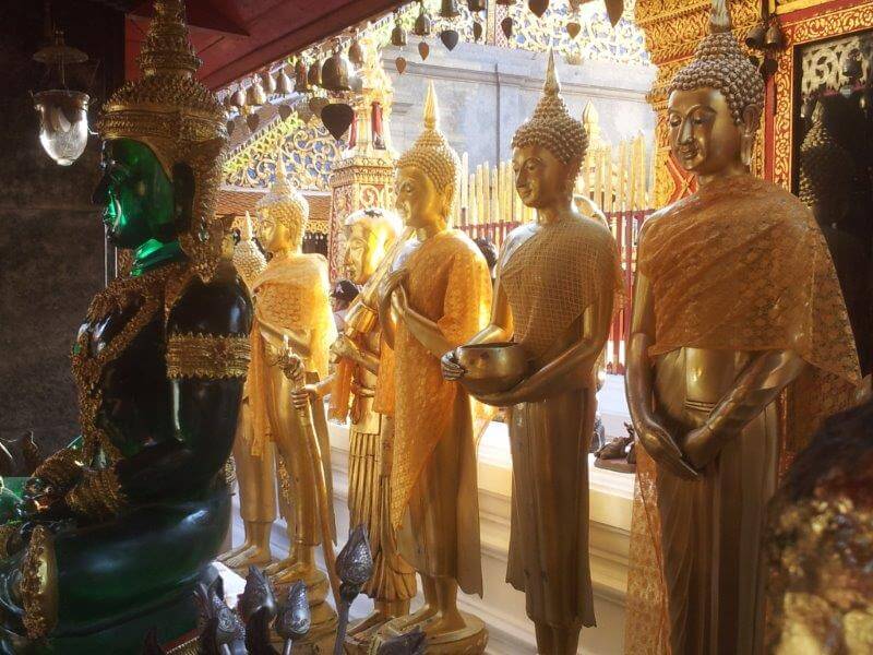 Golden statues and a green statue