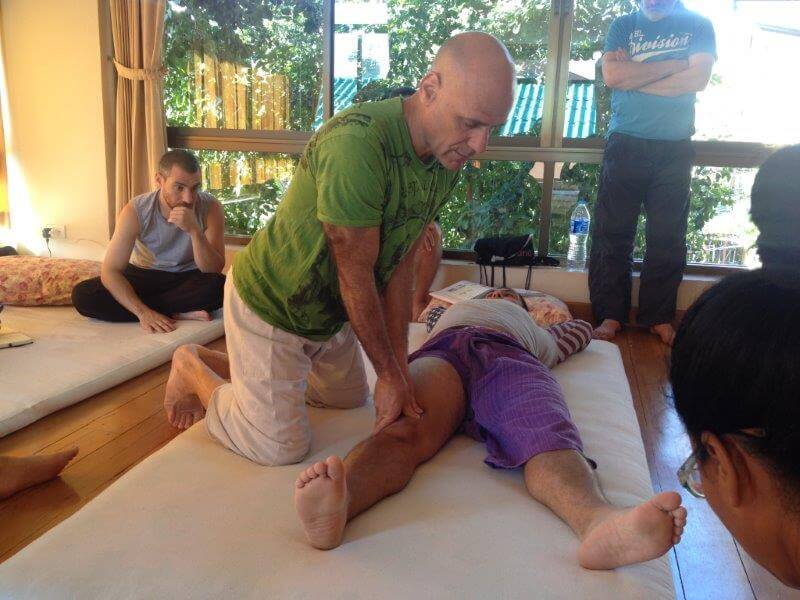 Noam Tyroler doing Thai Acupressure treatment for knee pain